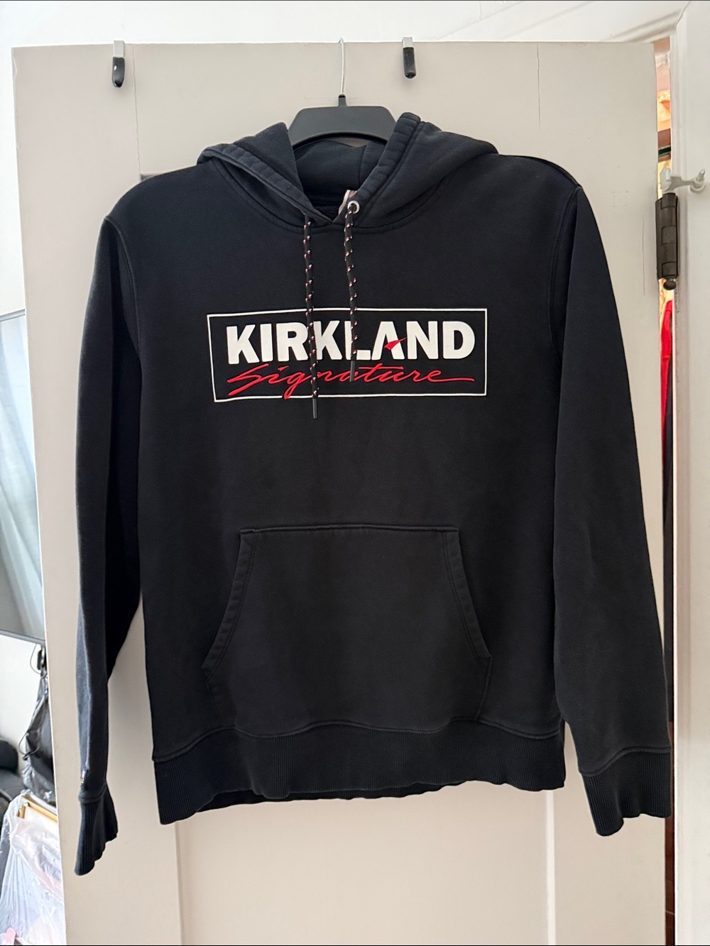Kirkland Signature Black Hoodie with White and Red Logo